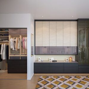 Custom closet systems and wardrobes with storage cabinets in wood grain finishes by California Closets Kent, Washington 