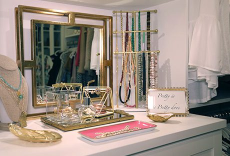 Image of an organized woman's dresser with jewelry and knickknacks