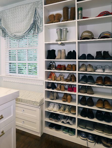 Custom white walk in closet with custom shoe rack
