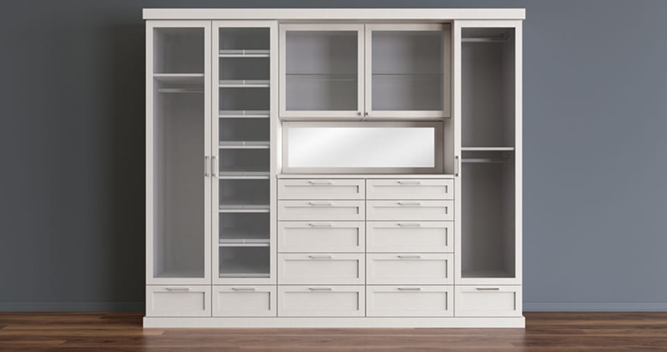 Floor to ceiling wardrobe with shelving, pull out drawers for storage and glass door.
