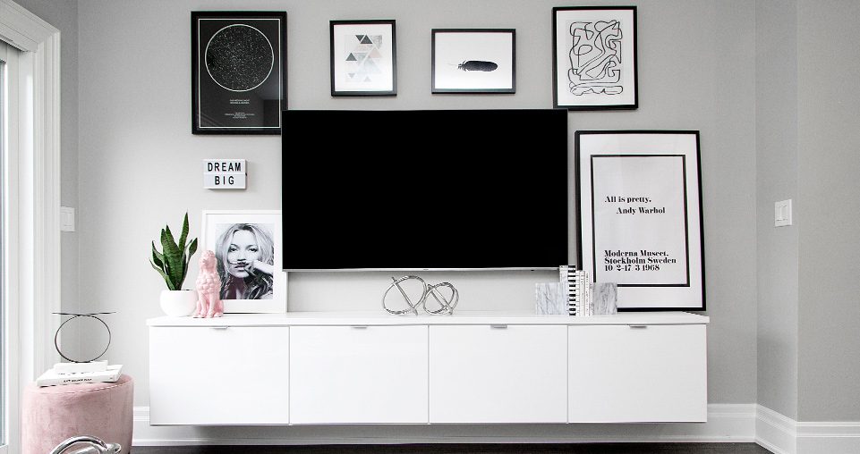 Custom white media center with floating cabinets by California Closets