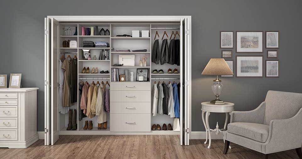 Reach in closet floor to ceiling design with shelving hanging racks and drawers.