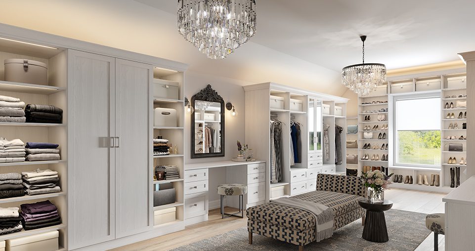 Custom walk-in closet with vanity, glass ceiling chandelier, with mirrors