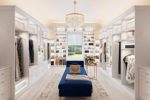 Luxe walk in closet with shoe storage, custom cabinets and open shelving by California Closets