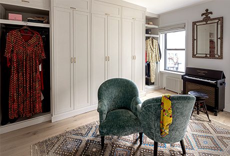 Jon Batiste and Suleika Jaouad's custom closet wardrobe in white linen wood grain finish by California Closets