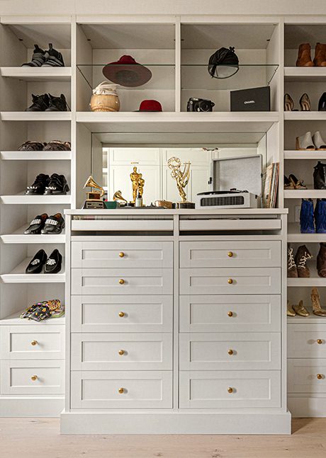 Luxury walk in closet with his and hers wardrobes and shoe shelving created for Suleika Jaouad and Jon Batiste