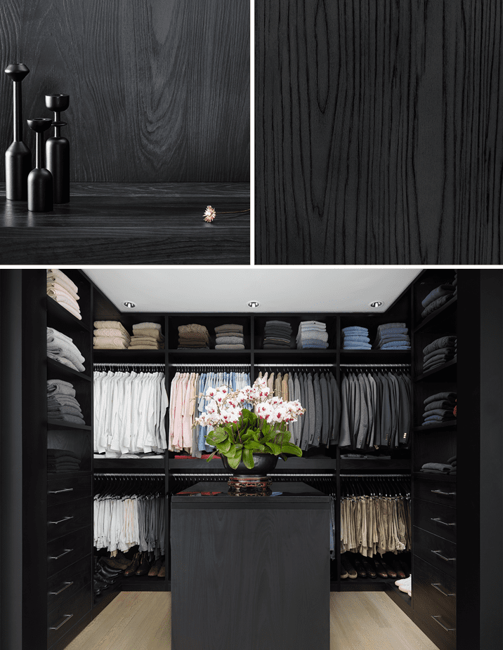 Vestidor con estantes personalizados, gabinetes y almacenamiento en la isla central con acabado de grano de madera negro creado por California Closets