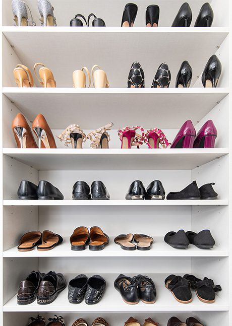 Custom shoe storage in Washington DC for Rachel Rosenthal and her husband in their walk in closets designed by California Closets