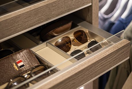 Antoni Porowski’s custom closet accessories drawers in a wood grain finish by California Closets