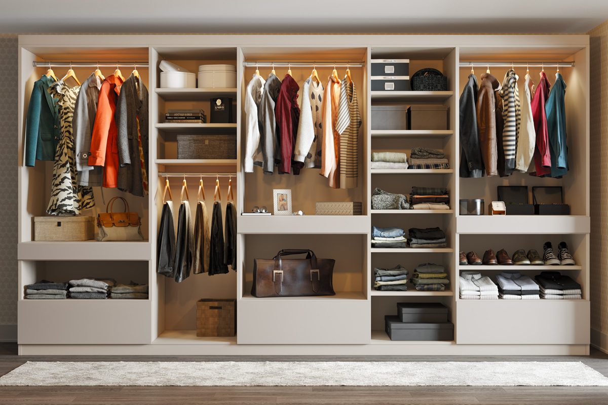 Reach in closet designed with eco-friendly materials and processes in light wood grain finish by California Closets