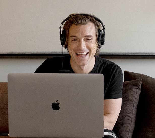 Jeremiah Brent delivering podcast on laptop with California Closets