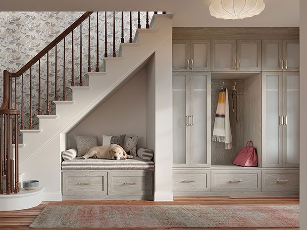 https://d35mbwdnoe7hvk.cloudfront.net/wp-content/uploads/2023/12/Luxe-entryway-storage-with-understairs-pet-bed-light-grey-finish-california-closets-1.jpg
