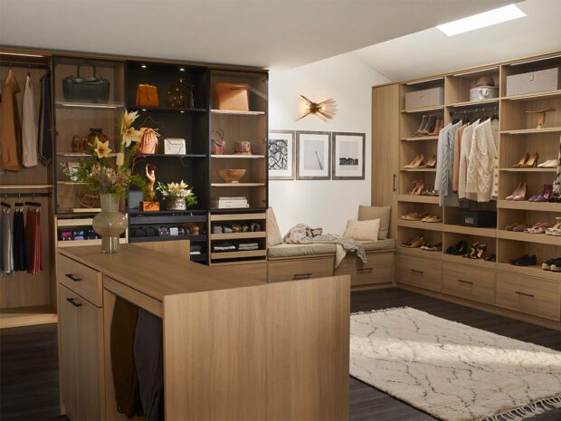 Closets storage solution with island in the middle for more storage space custom designed by California Closets.