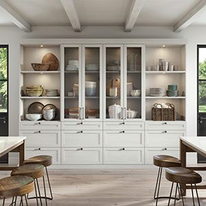 https://d35mbwdnoe7hvk.cloudfront.net/wp-content/uploads/2024/01/Custom-kitchen-storage-pantry-white-wood-grain-cabinets-glass-doors-california-closets.jpg