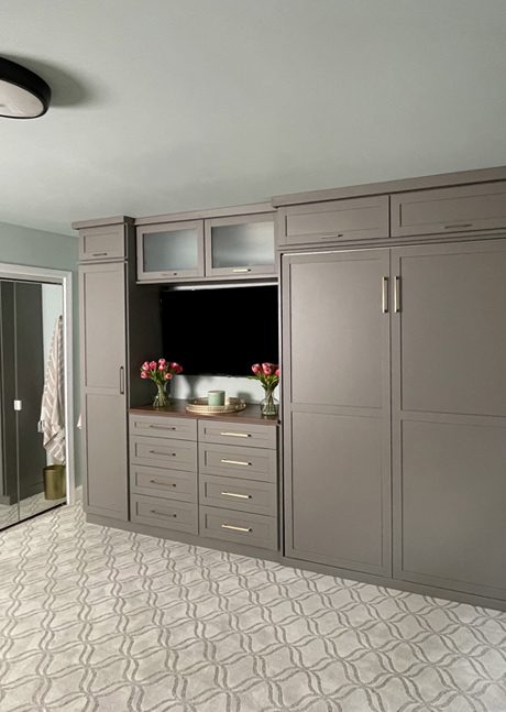 Murphy bed storage cabinet design in matte grey wood grain finish by California Closets