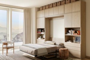 Murphy bed with cabinets and shelving shown opened in vertical position by California Closets